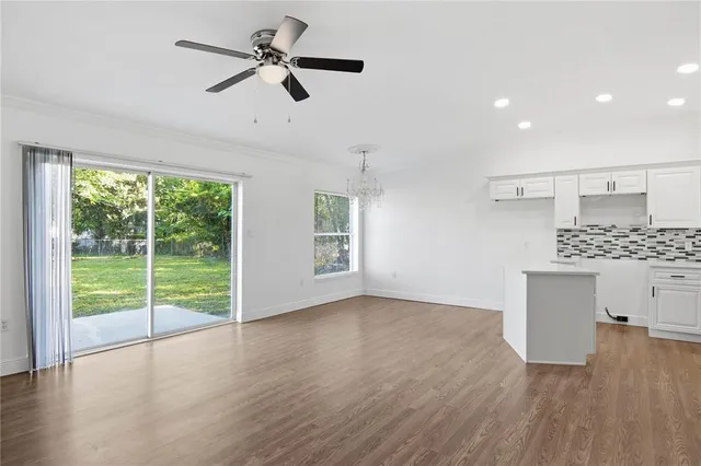 a view of kitchen with wooden floor and window