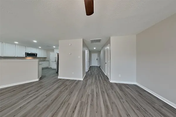 a view of kitchen with wooden floor