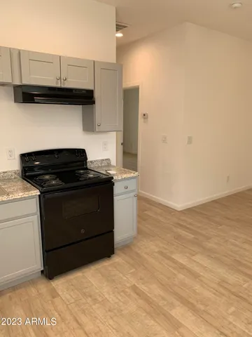a kitchen with a sink and a stove
