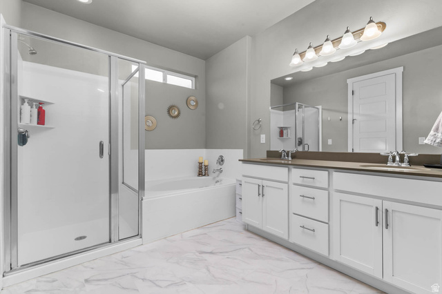 5686 Duke Lane Tooele, UT 84074 - Photo 22 of 38 Full bath featuring a stall shower, double vanity, and a garden tub