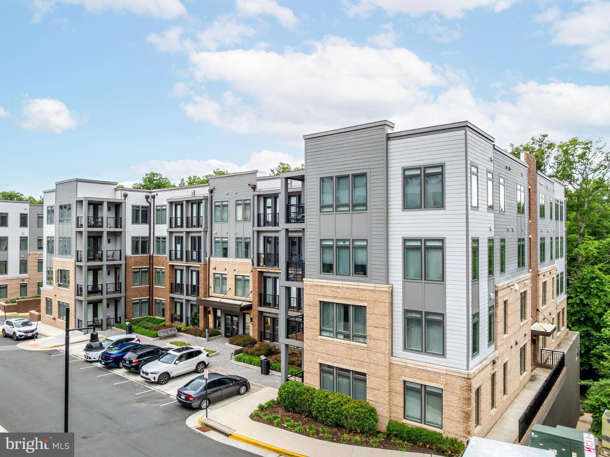 1675 Bandit Loop, Unit 105B Reston, VA 20190 - Photo 26 of 27 a city street lined with tall buildings