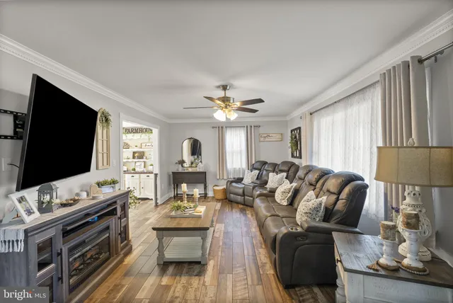 a kitchen with stainless steel appliances granite countertop a sink refrigerator and microwave