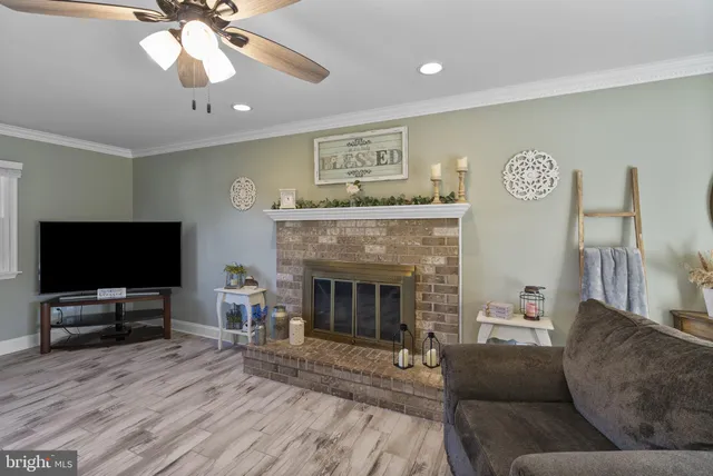 a bedroom with two beds and a flat screen tv