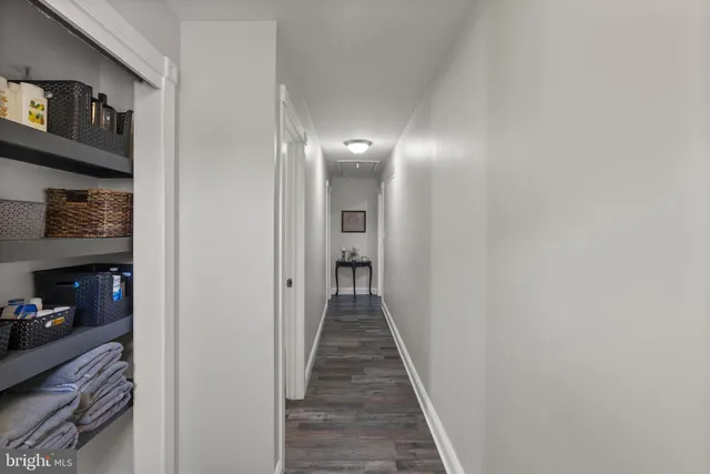 a view of a hallway with outdoor seating