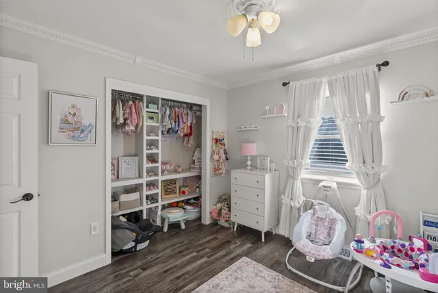 a view of a livingroom with furniture and a gym cycle