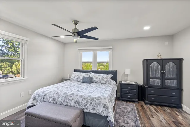 a bedroom with a bed and a couch