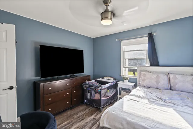 a view of a patio with a table chairs and a backyard