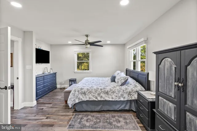 a view of a house with backyard porch and sitting area