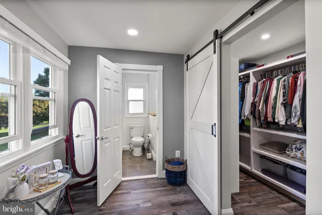 a aerial view of a house with swimming pool garden and mountain view