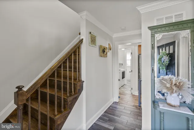 a kitchen with kitchen island granite countertop a sink window and cabinets