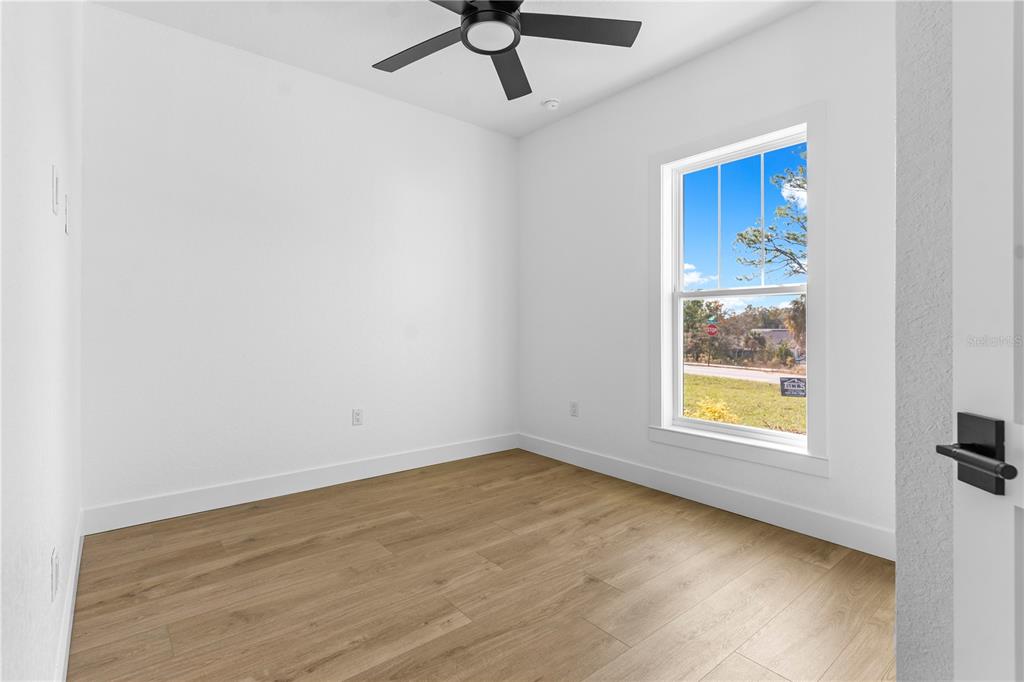 8090 Nordica Road Brooksville, FL 34613 - Photo 15 of 56 a view of an empty room with a window