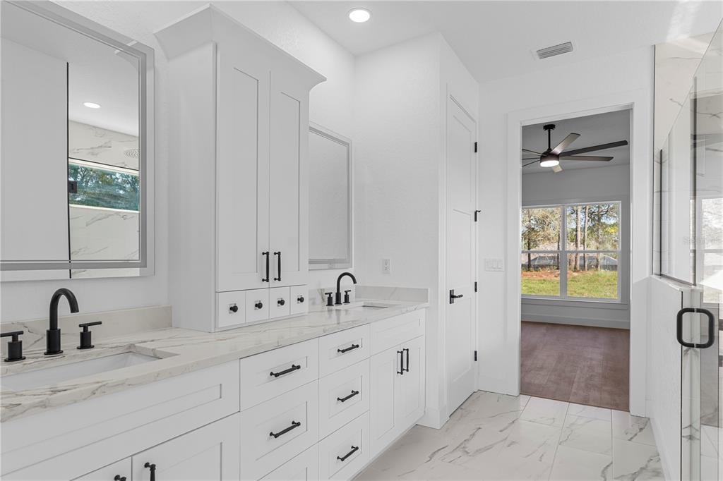 8090 Nordica Road Brooksville, FL 34613 - Photo 21 of 56 a bathroom with a sink and a mirror