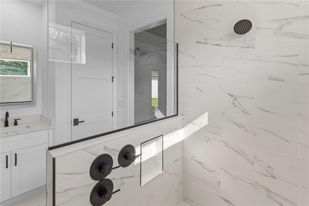 8090 Nordica Road Brooksville, FL 34613 - Photo 24 of 56 a bathroom with a sink and a mirror