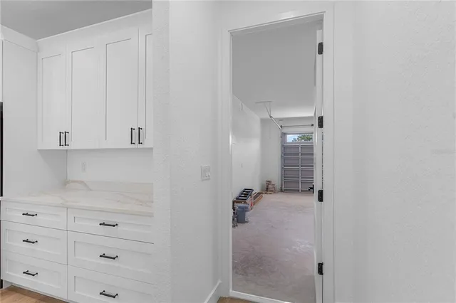 a bathroom with a granite countertop sink a toilet and shower