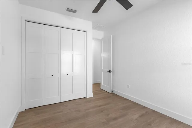 a view with a sink and dishwasher with wooden floor