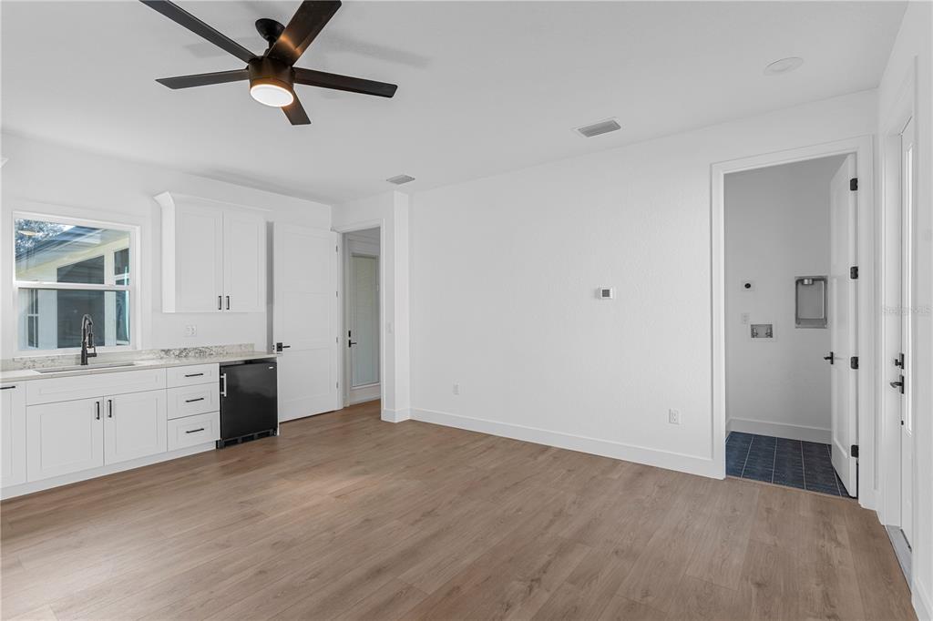 8090 Nordica Road Brooksville, FL 34613 - Photo 38 of 56 a view of an empty room with window and cabinet