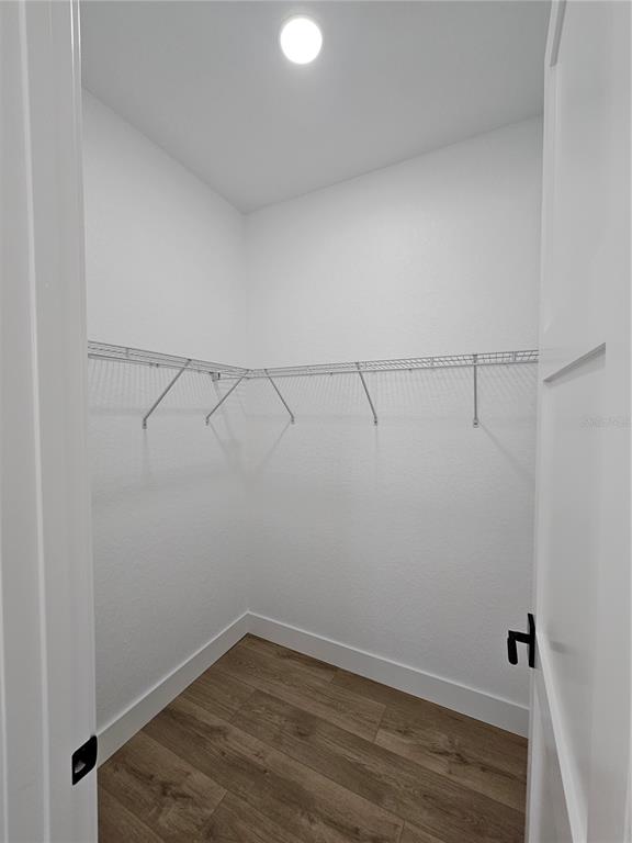 8090 Nordica Road Brooksville, FL 34613 - Photo 39 of 56 a view of a room with racks on the wall