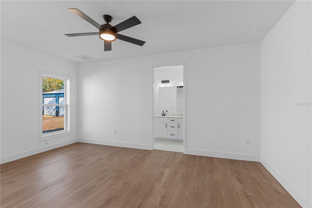 8090 Nordica Road Brooksville, FL 34613 - Photo 41 of 56 wooden floor in an empty room