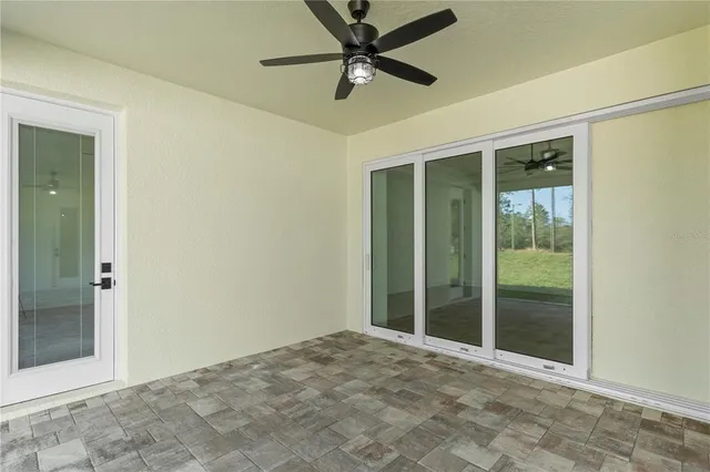 an aerial view of a house with yard