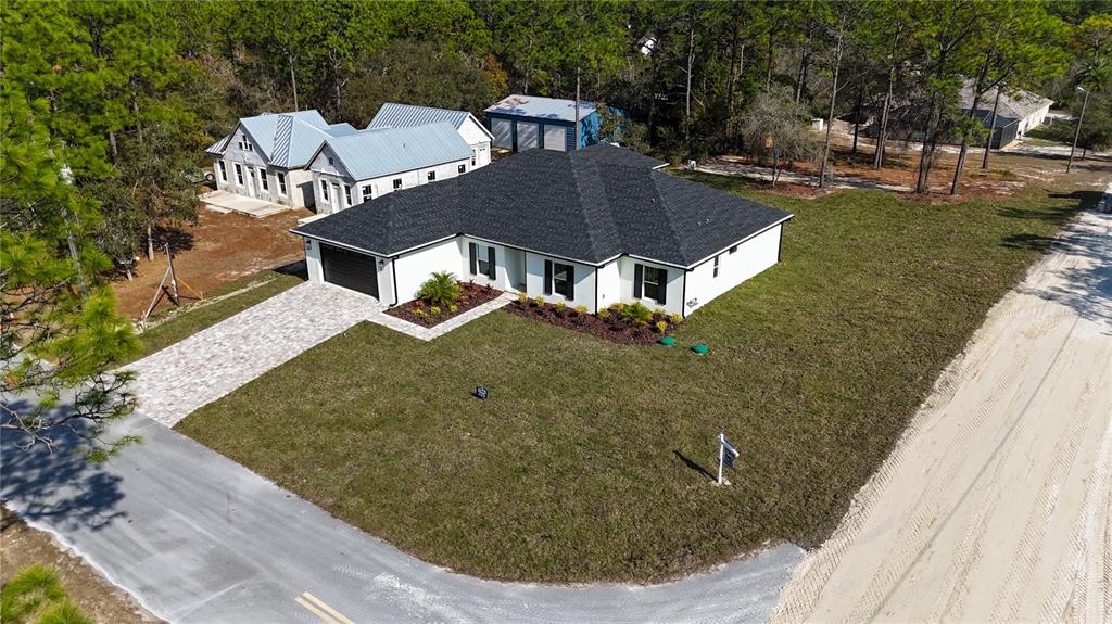 8090 Nordica Road Brooksville, FL 34613 - Photo 52 of 56 a view of a house with a yard
