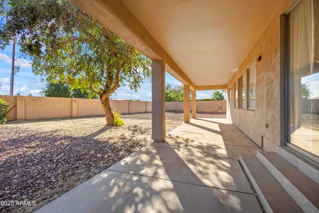 a view of a back yard from a balcony