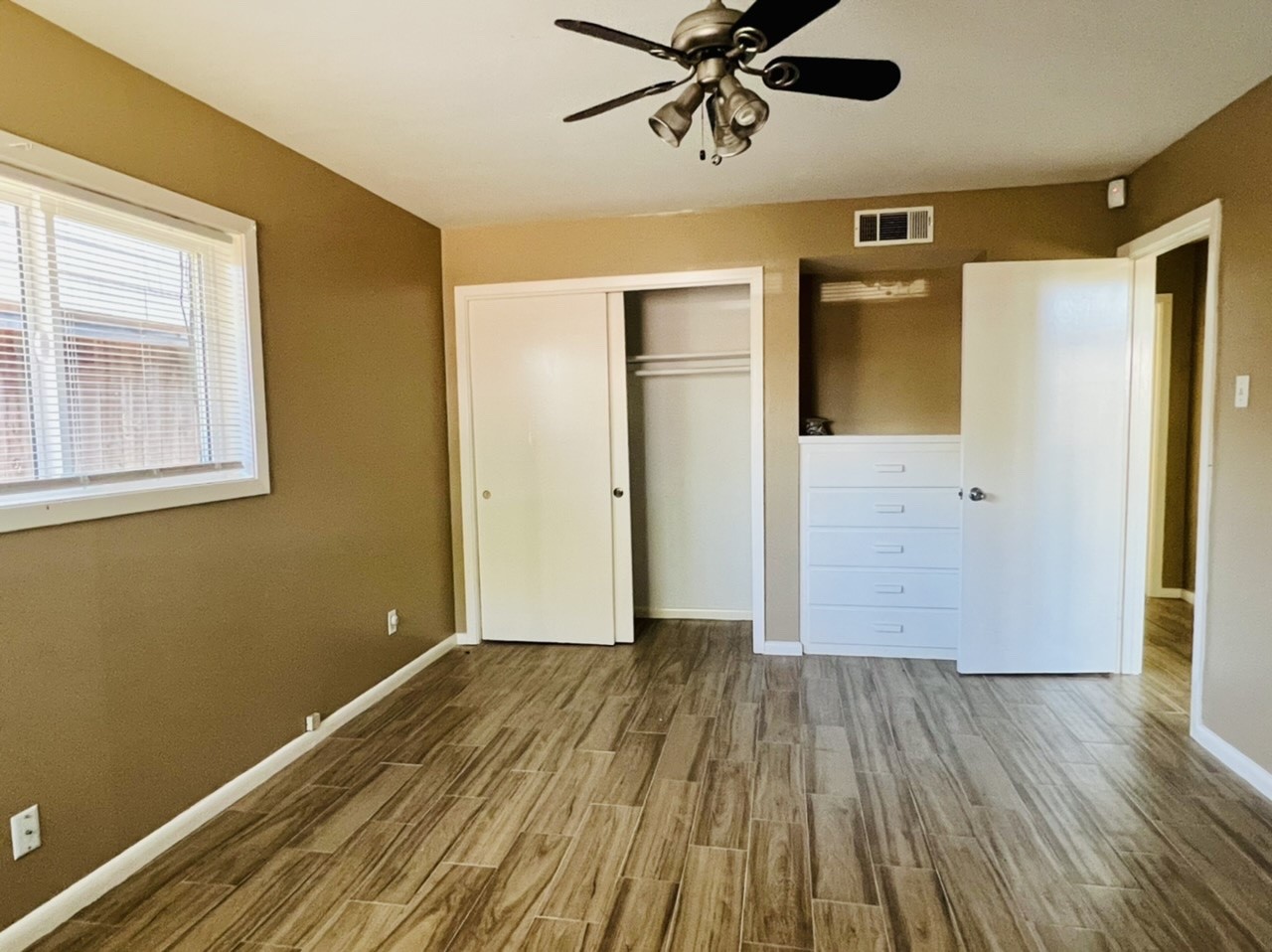 4731 Merwin Street Houston, TX 77027 - Photo 12 of 28 wooden floor in an empty room with a window