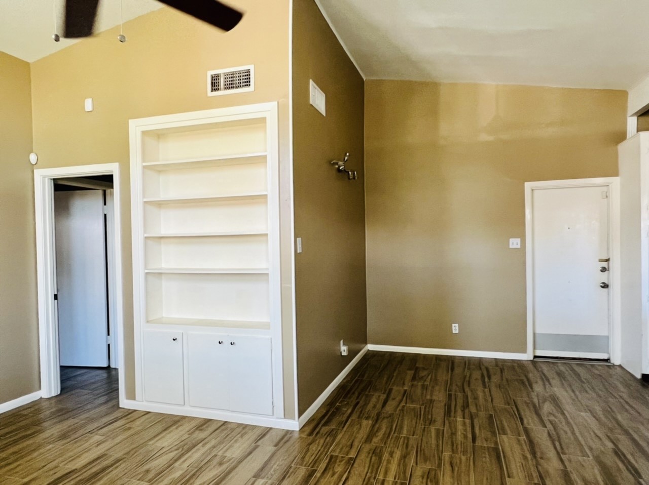 4731 Merwin Street Houston, TX 77027 - Photo 21 of 28 a view of a hallway with wooden floor and closet