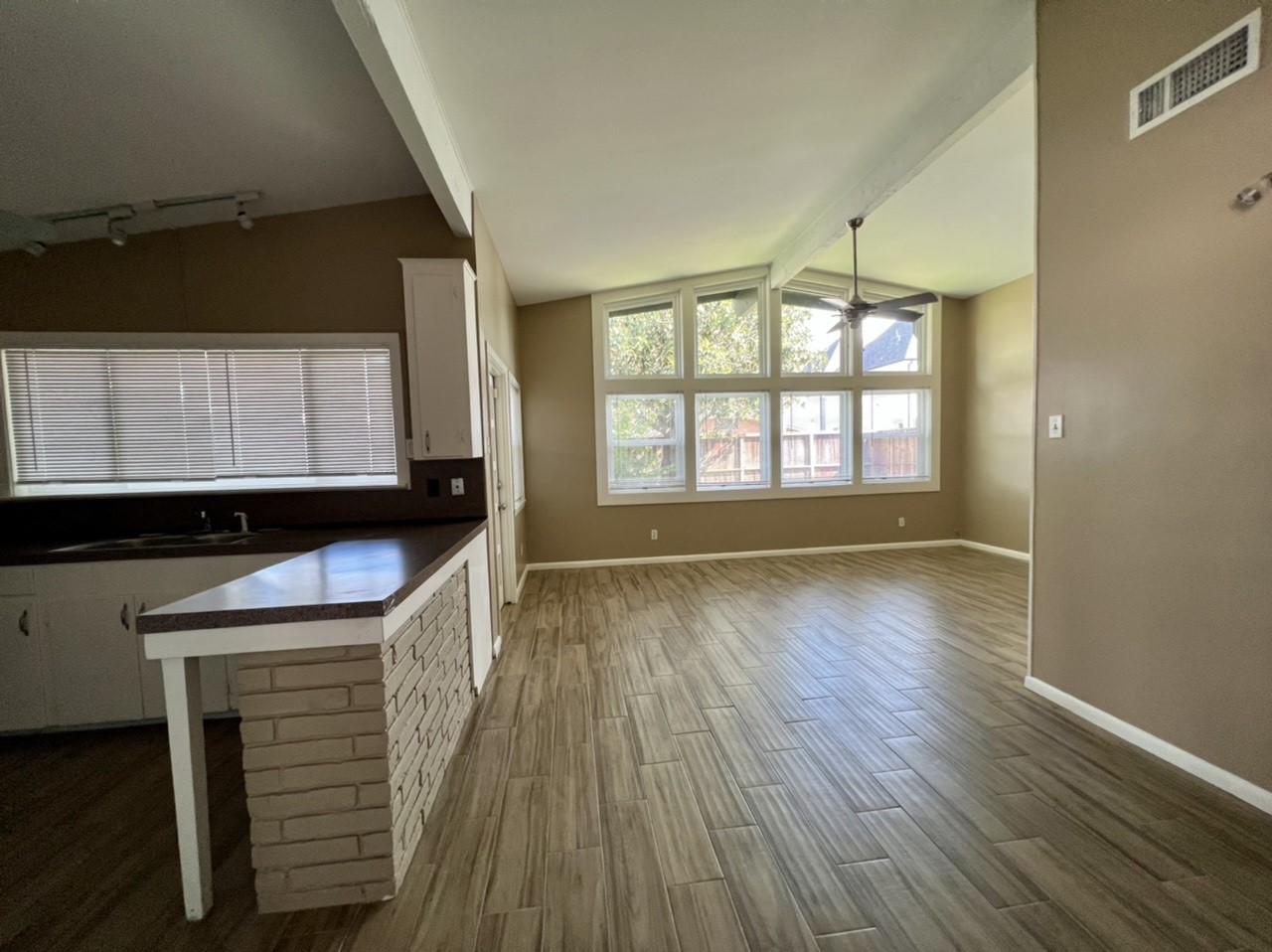 4731 Merwin Street Houston, TX 77027 - Photo 22 of 28 an empty room with wooden floor and windows
