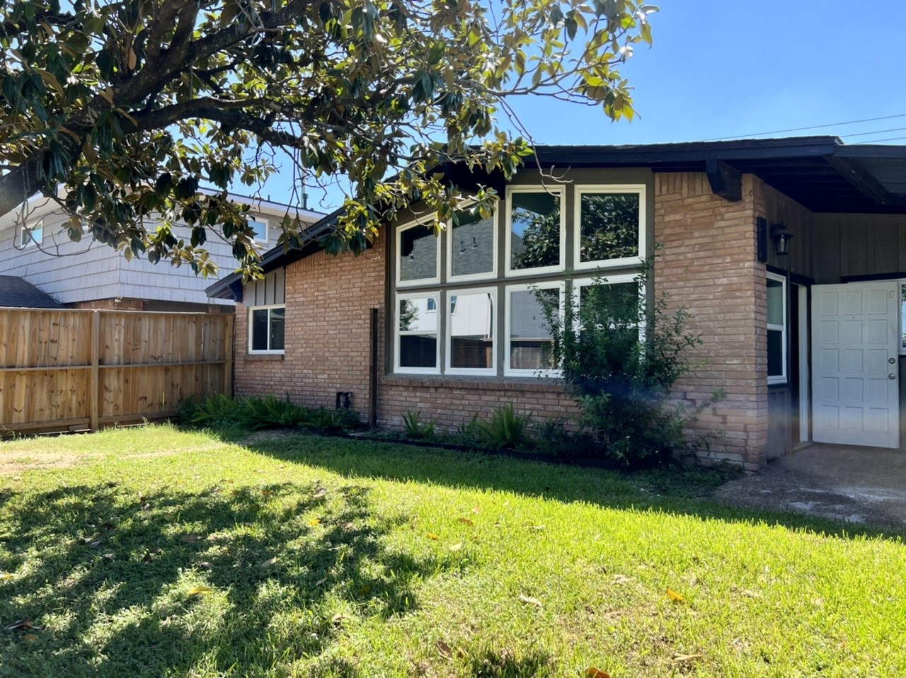 4731 Merwin Street Houston, TX 77027 - Photo 26 of 28 a view of a house with a yard