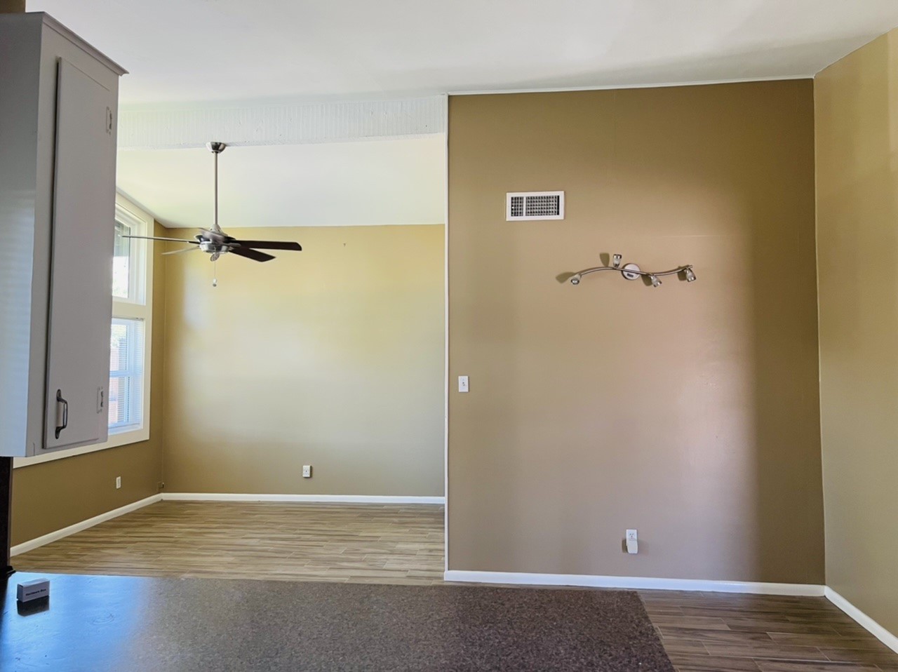 4731 Merwin Street Houston, TX 77027 - Photo 7 of 28 a view of a room with wooden floor