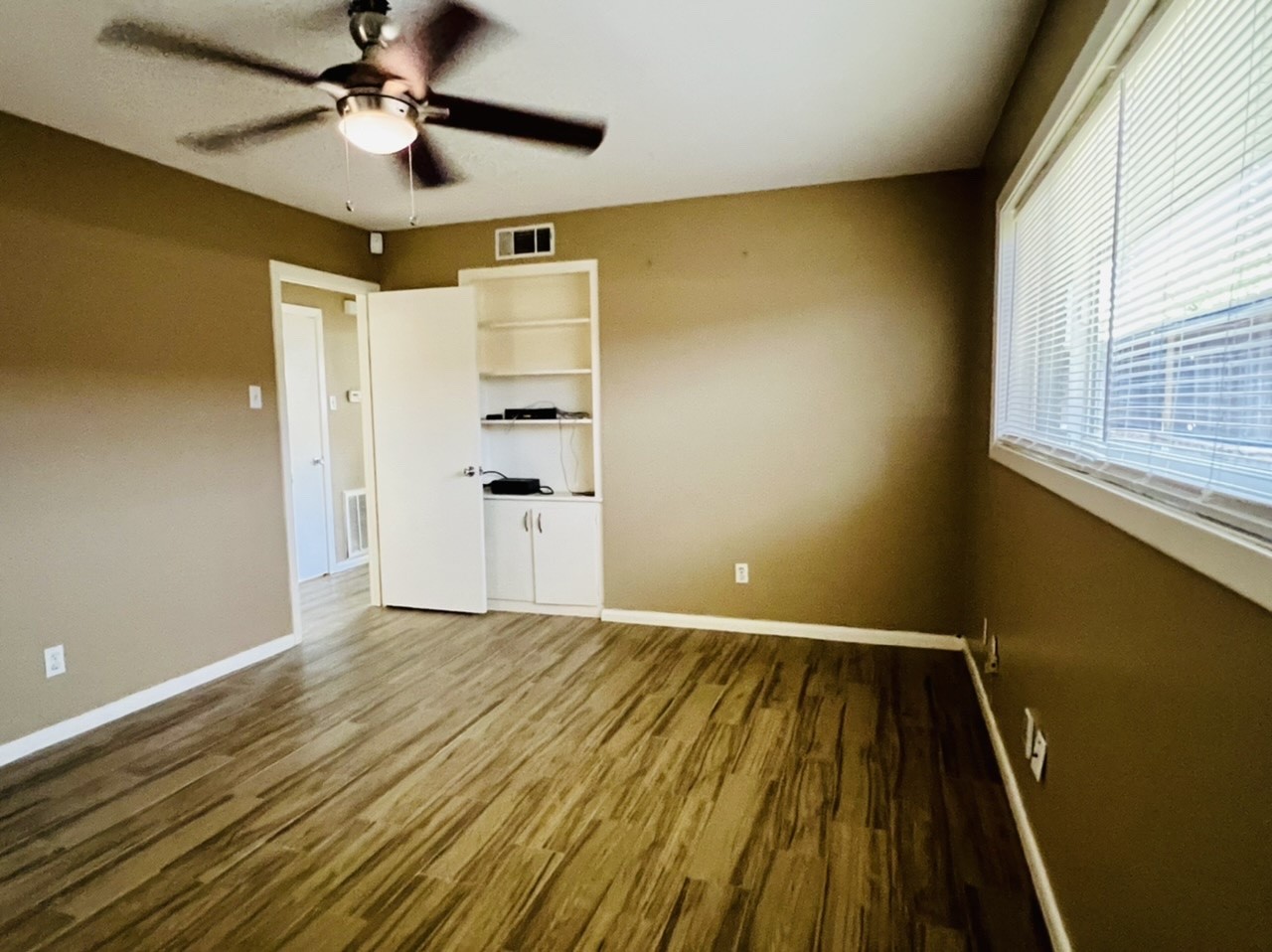 4731 Merwin Street Houston, TX 77027 - Photo 9 of 28 a view of an empty room with a window