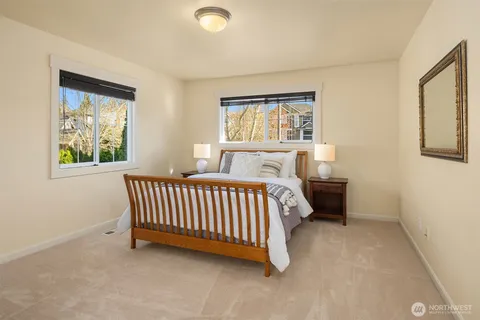 a spacious bedroom with a bed and a window
