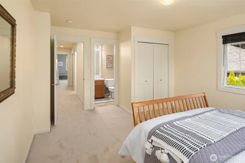 a bedroom with a bed and a table