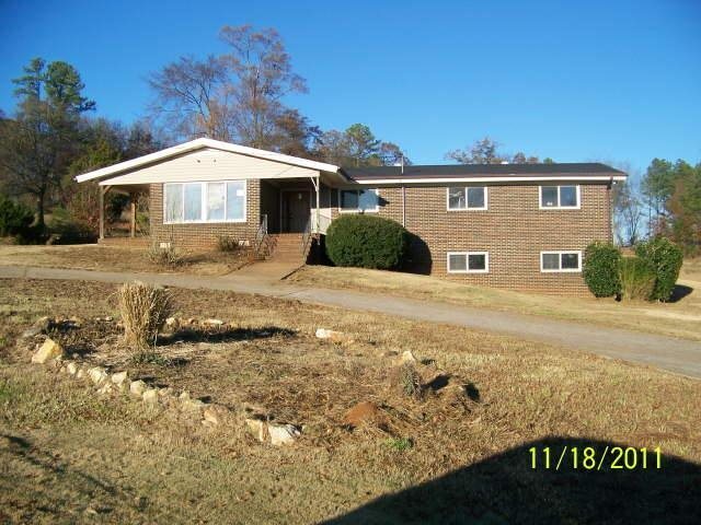 496 Adams Road Cedartown, GA 30125 - Photo 1 of 1 a front view of a house with a yard