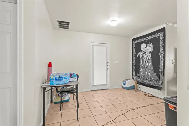 a bedroom with a bed and a table in it