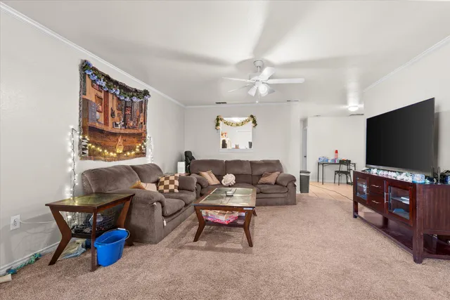 a living room with furniture and a flat screen tv