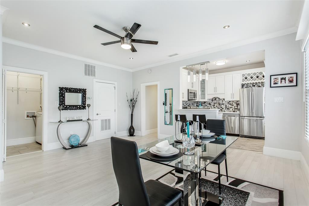 4719 Junius Street, Unit 3 Dallas, TX 75246 - Photo 11 of 36 a view of a dining room with furniture and a potted plant