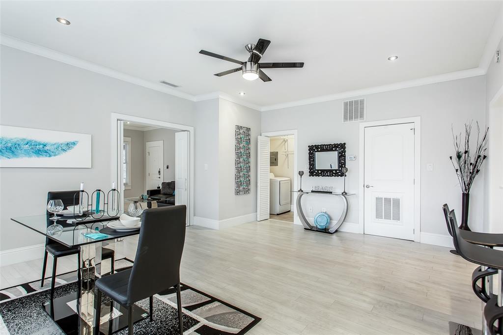 4719 Junius Street, Unit 3 Dallas, TX 75246 - Photo 12 of 36 a view of a livingroom with furniture and a flat screen tv