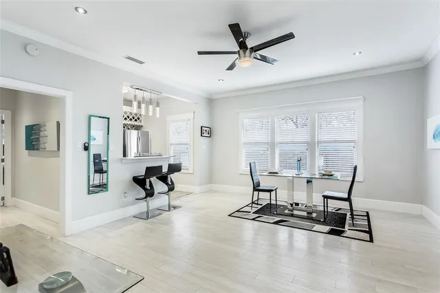 a view of a livingroom with furniture and a window