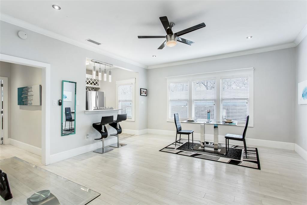 4719 Junius Street, Unit 3 Dallas, TX 75246 - Photo 13 of 36 a view of a livingroom with furniture and a window
