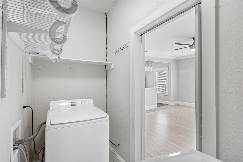 4719 Junius Street, Unit 3 Dallas, TX 75246 - Photo 14 of 38 a view of storage and utility room with washer and dryer