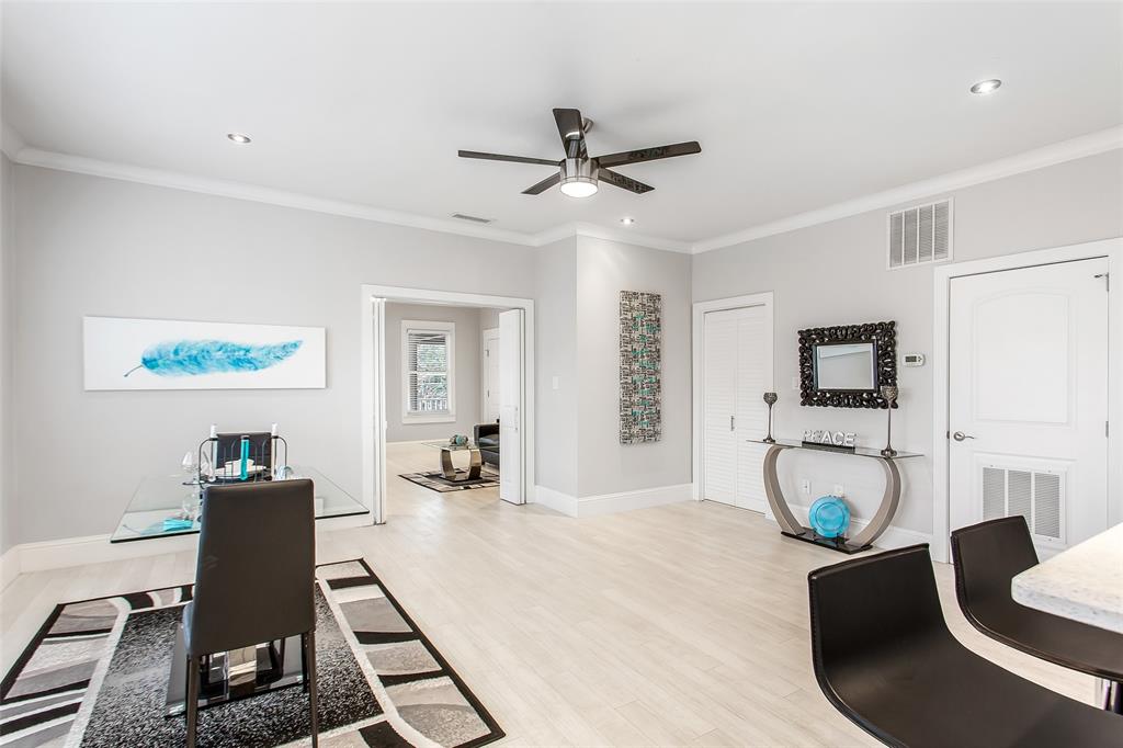 4719 Junius Street, Unit 3 Dallas, TX 75246 - Photo 18 of 36 a living room with furniture a flat screen tv and a fireplace