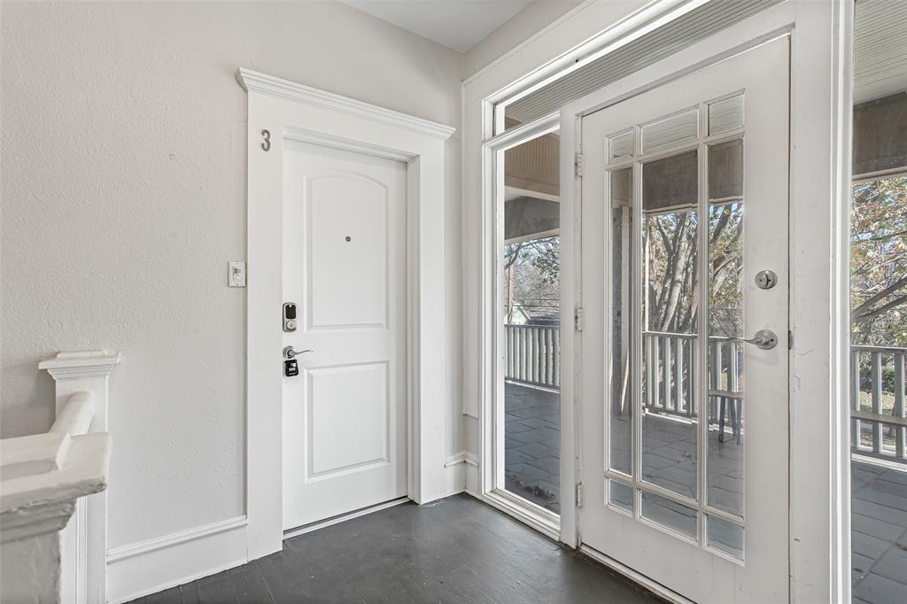 4719 Junius Street, Unit 3 Dallas, TX 75246 - Photo 2 of 38 a view of a bathroom from a hallway