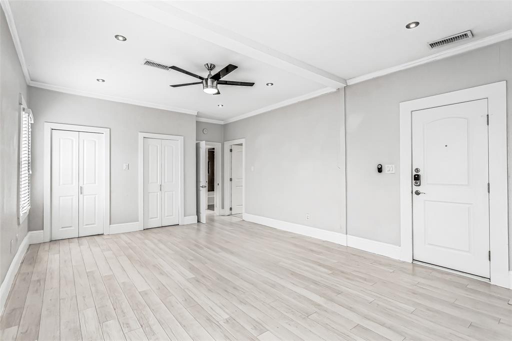 4719 Junius Street, Unit 3 Dallas, TX 75246 - Photo 25 of 38 a view of an empty room with wooden floor