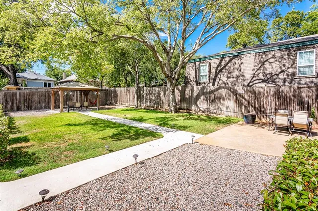 a view of a backyard with a small yard