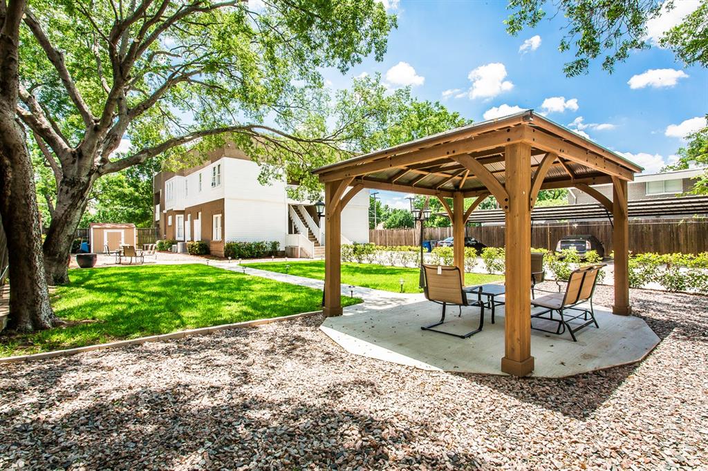 4719 Junius Street, Unit 3 Dallas, TX 75246 - Photo 32 of 36 a view of a house with backyard and sitting area