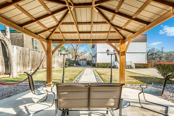 a view of a backyard with sitting area