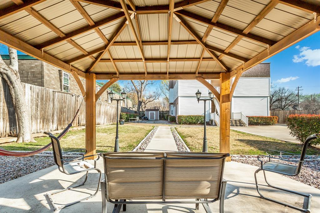 4719 Junius Street, Unit 3 Dallas, TX 75246 - Photo 32 of 38 a view of a swimming pool with a patio