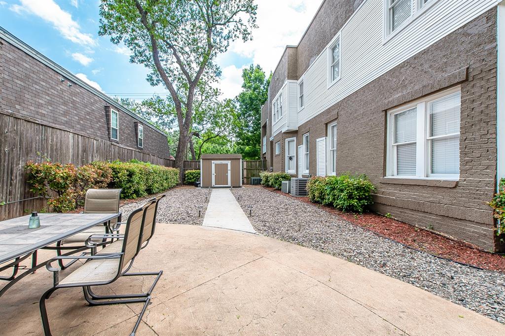 4719 Junius Street, Unit 3 Dallas, TX 75246 - Photo 33 of 38 a view of a backyard with sitting area