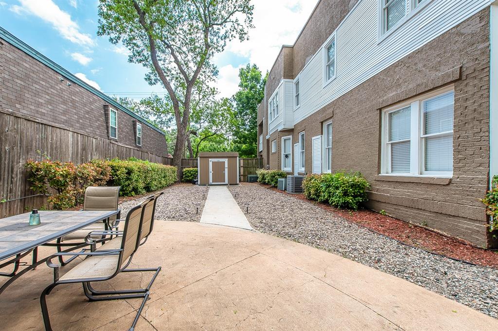 4719 Junius Street, Unit 3 Dallas, TX 75246 - Photo 33 of 36 a view of backyard with outdoor seating and plants